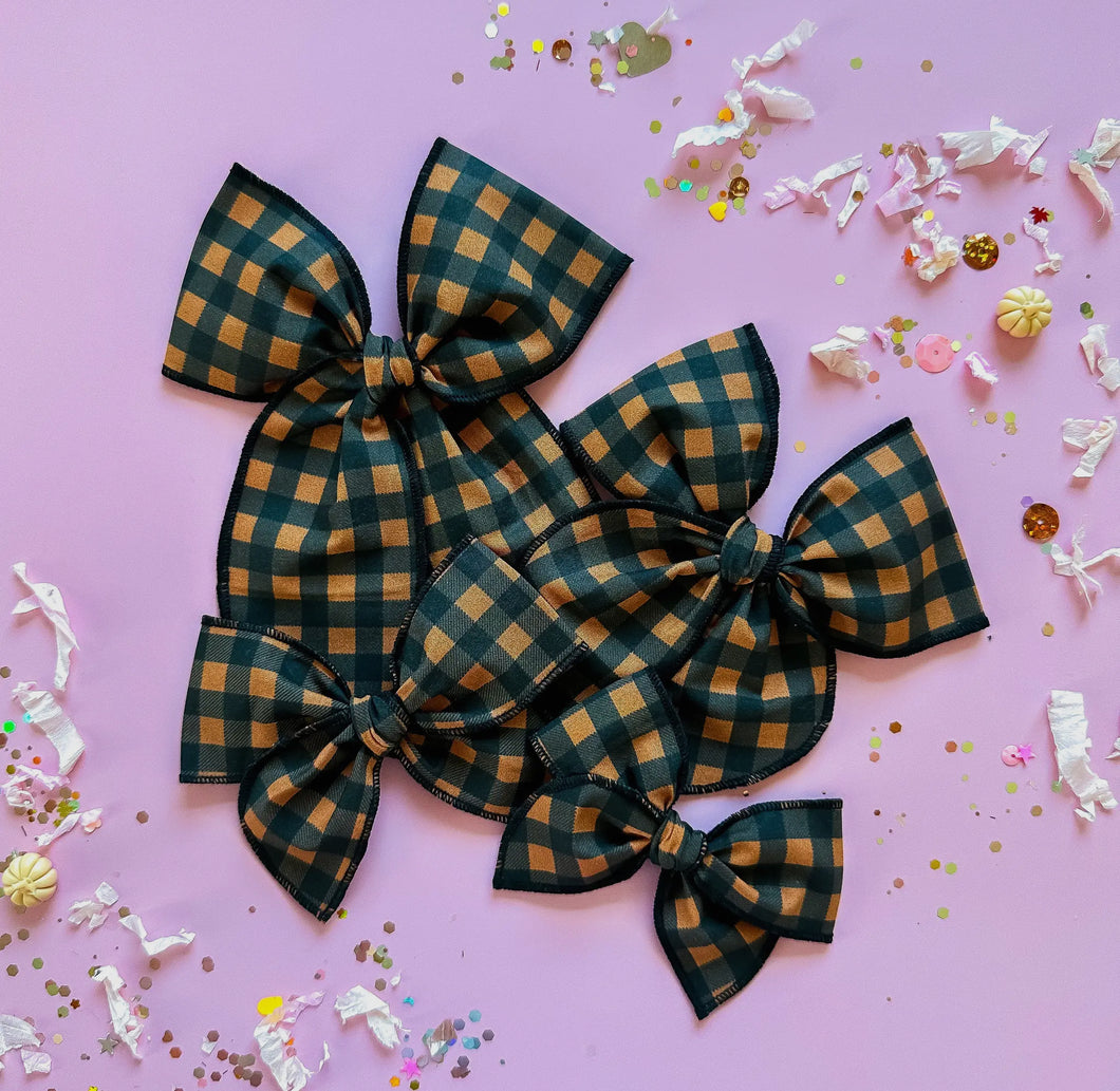 Black and orange checkered bow