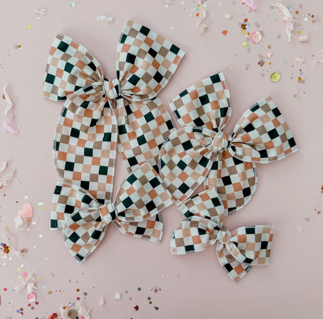 Neutral colored checkered bow