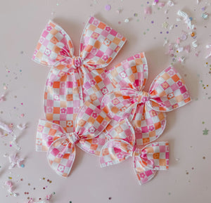 Pink and orange checkered bow