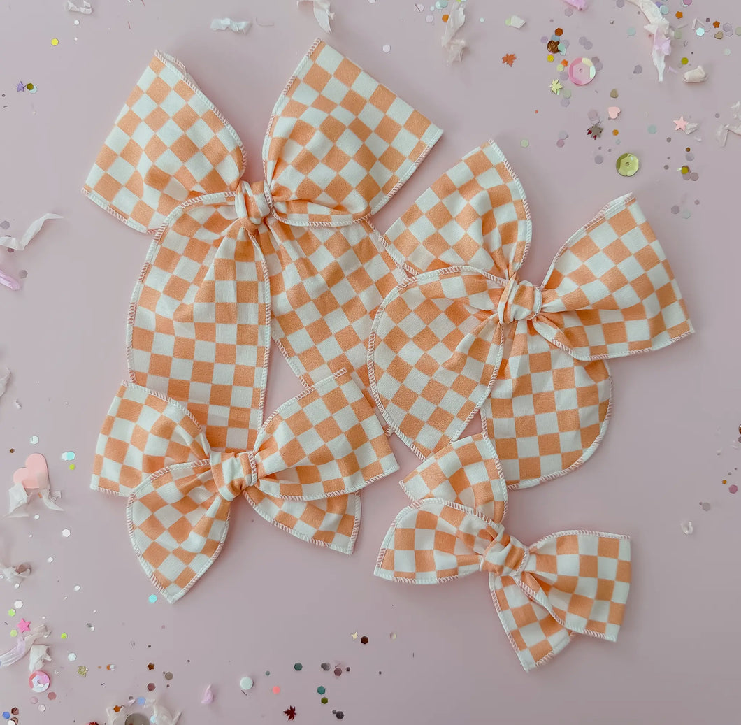 Orange and beige checkered bow