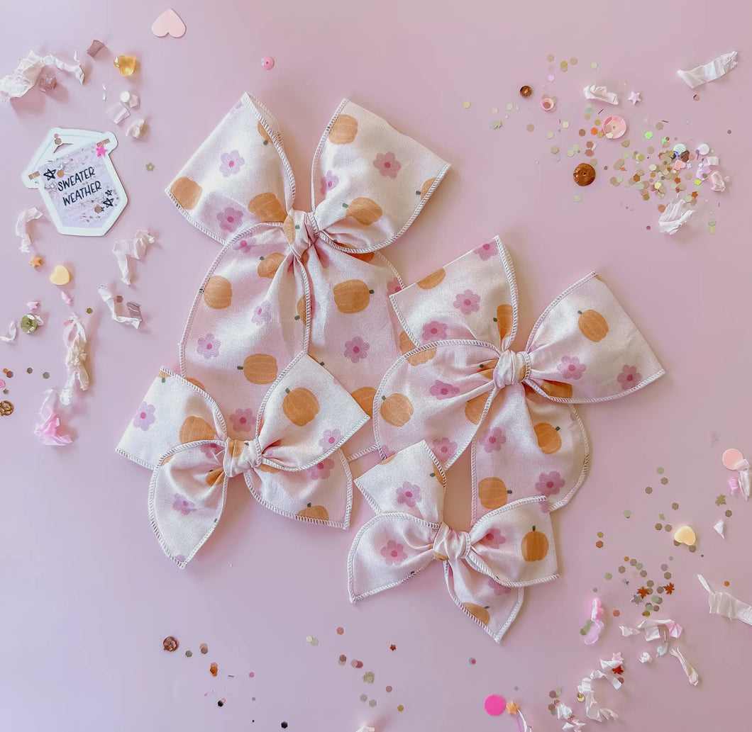 Pink flowers and pumpkin bow
