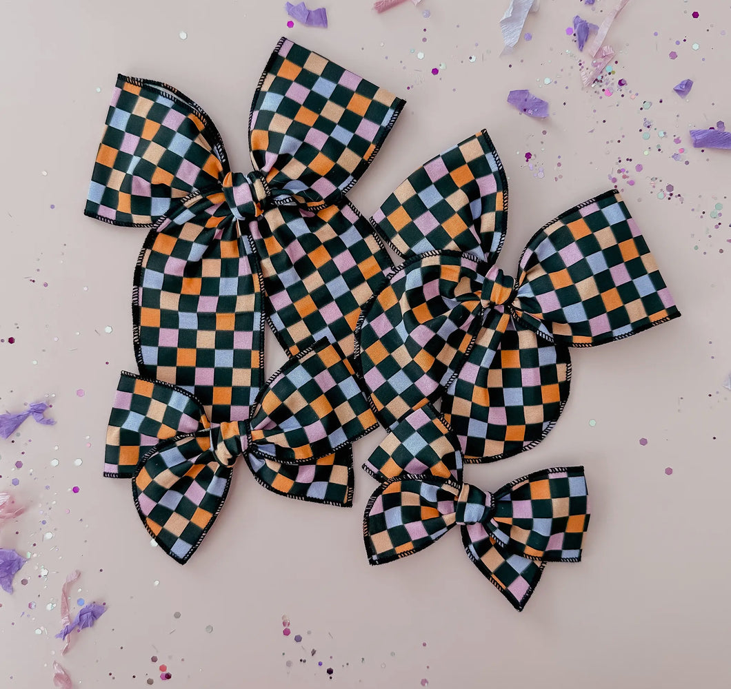 Black and colorful checkered bow